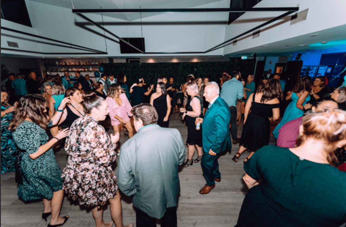 Guests dancing at a Christmas function